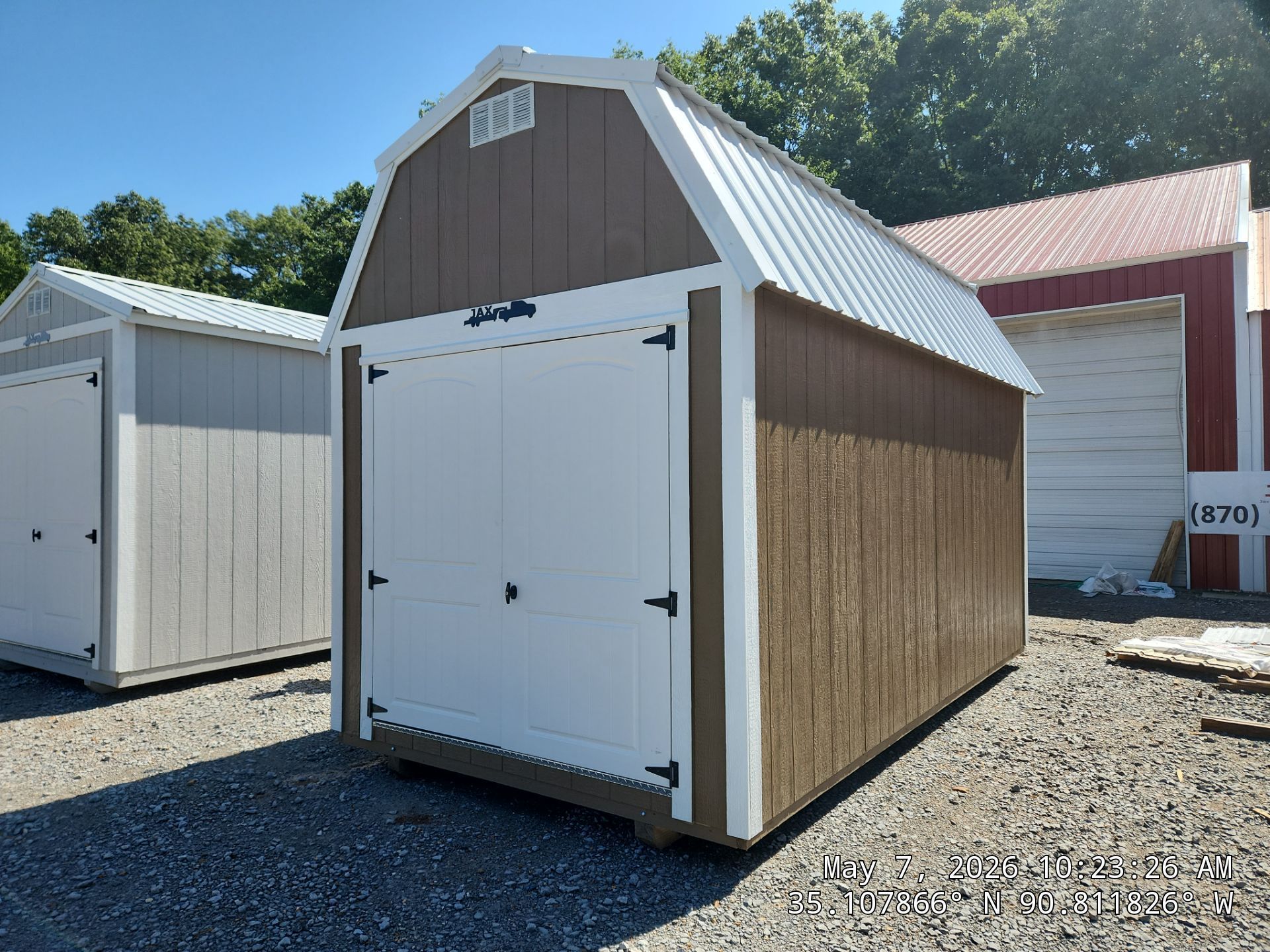 brown lofted barn with double doors