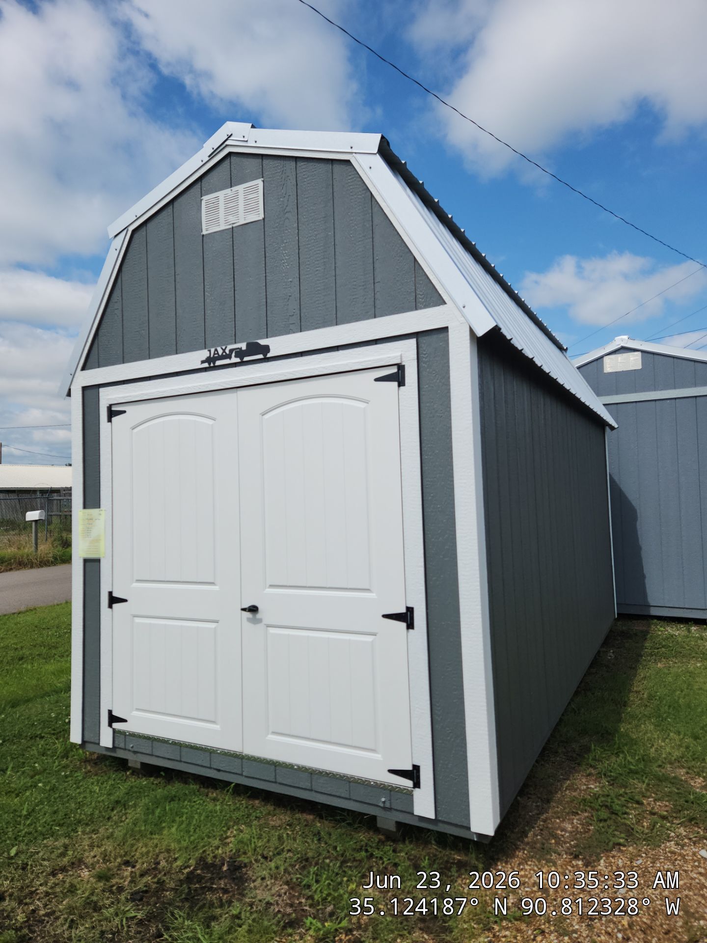 dark gray lofted barn with double doors