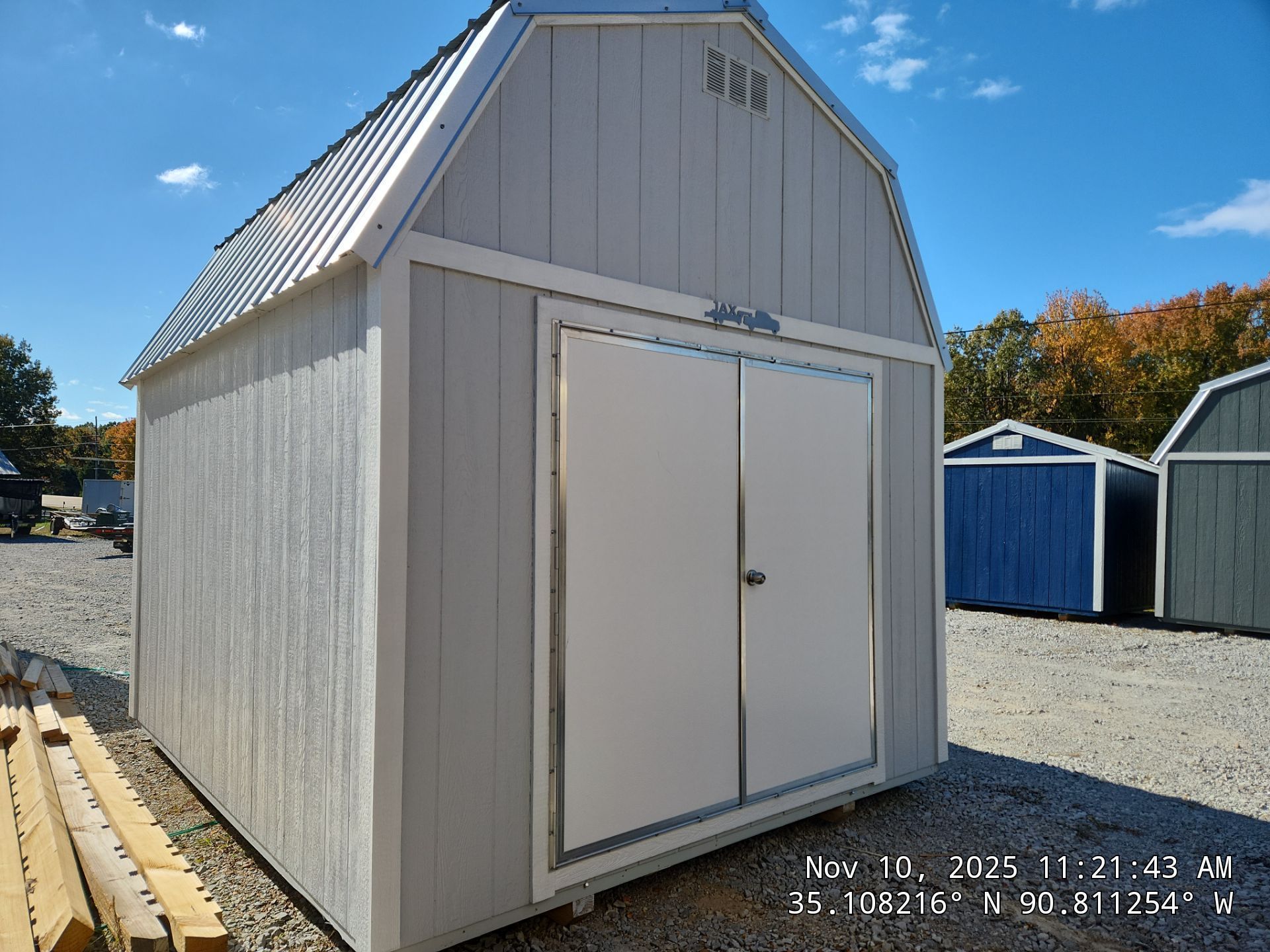 light gray lofted barn with double doors