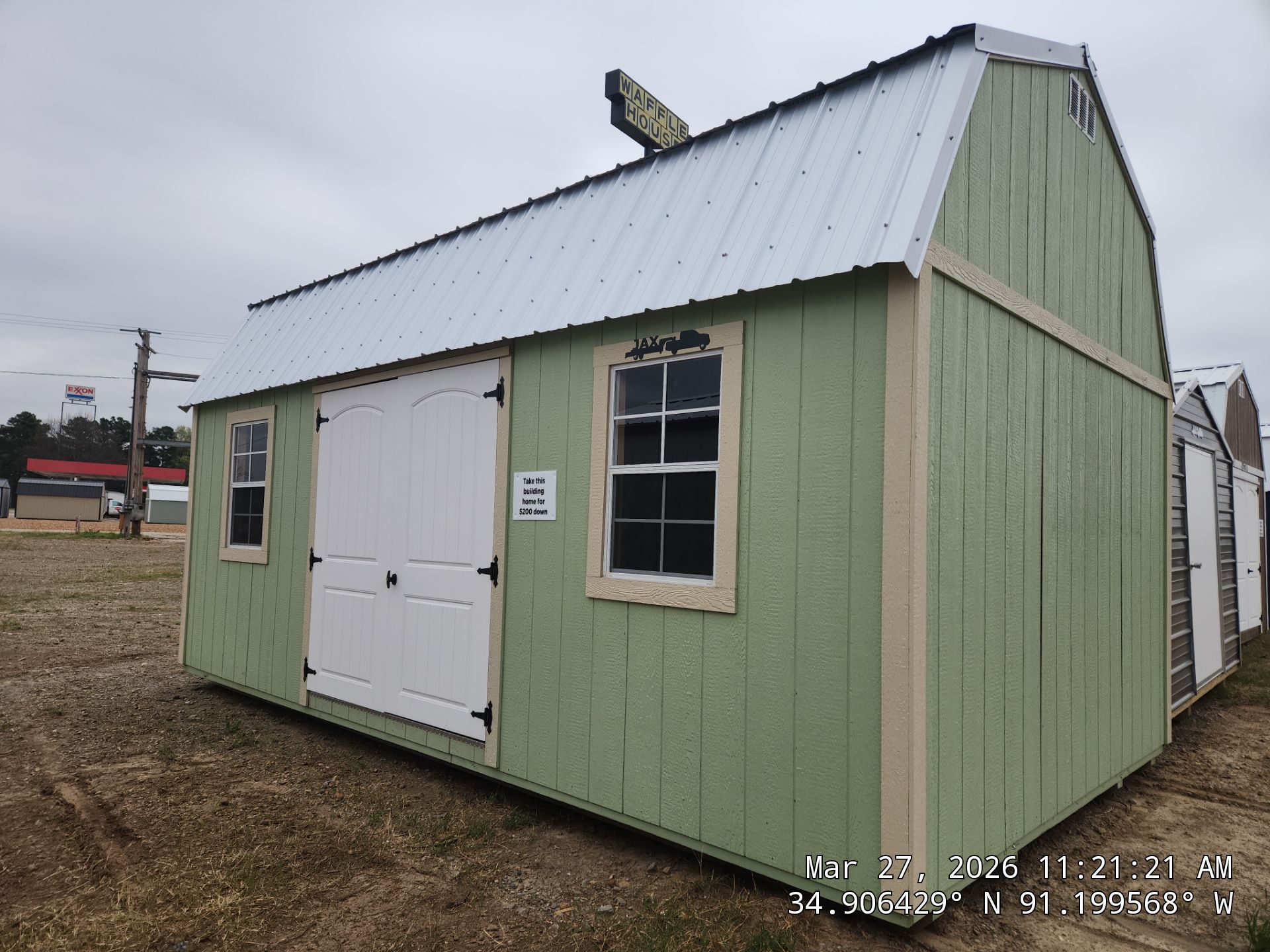 light green side lofted barn with double doors
