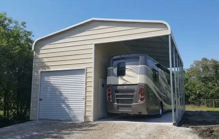 Motorhome parked inside a beige metal garage with a roll-up door.