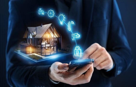 A person uses a phone to control a smart home; glowing icons connect to a house model.