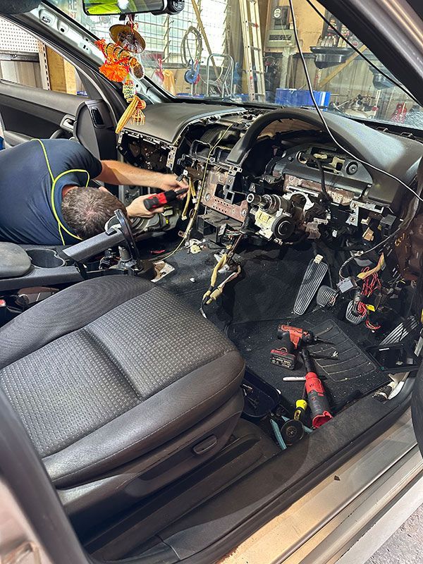 Man is Working on the Interior of a Car — Darwin Auto Mobile Care in Woolner, NT
