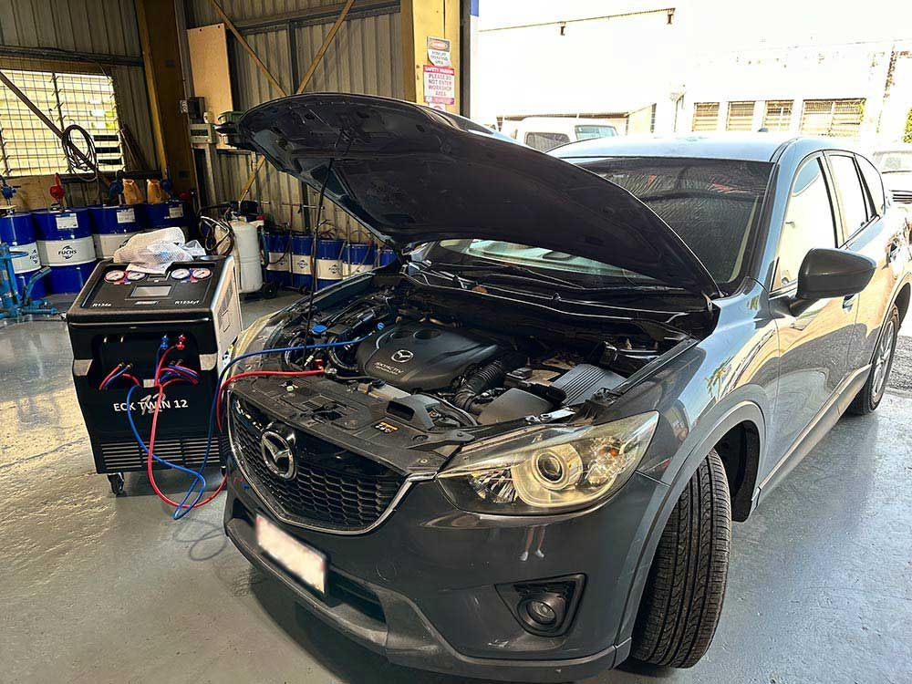 Mazda CX-5 With Its Hood Up in a Garage — Darwin Auto Mobile Care in Woolner, NT