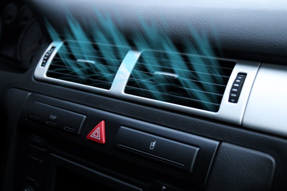 Person is Adjusting the Air Conditioner in a Car — Darwin Auto Mobile Care in Woolner, NT