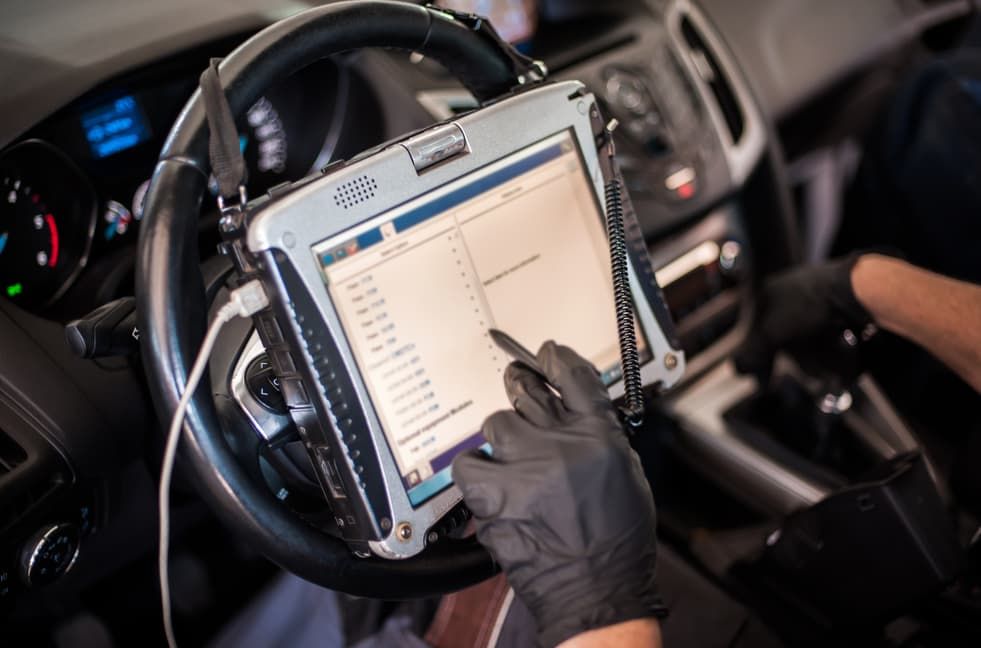 Person Using A Tablet Diagnostic Tool In A Car β Darwin Auto Mobile Care in Woolner, NT