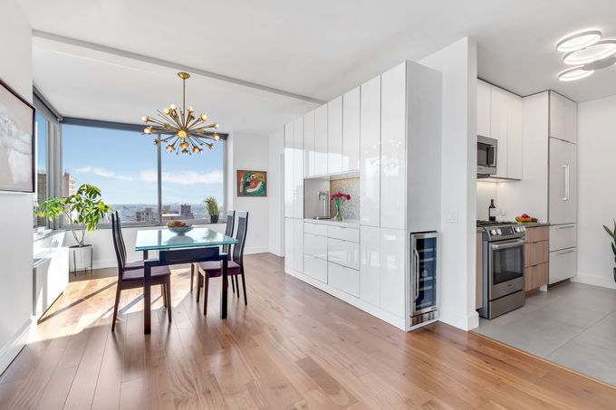 There is a dining room table and chairs in the middle of the room.