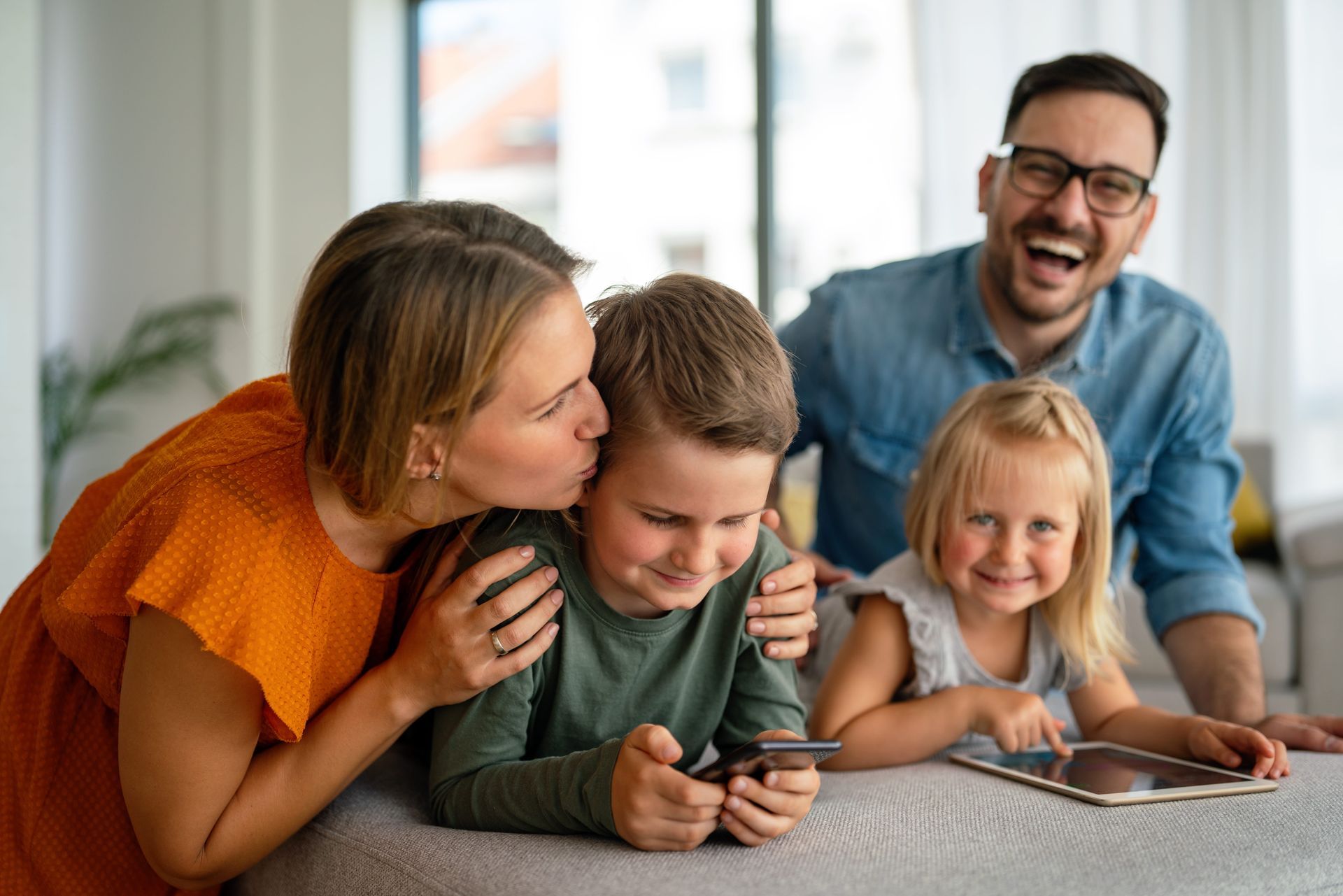 Happy family at home representing the importance of estate planning to protect loved ones
