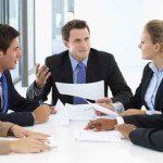 Group Of Business People Having Meeting In Office