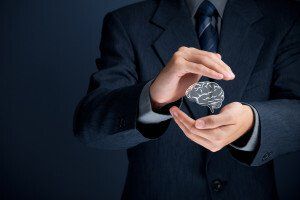 man holding brain graphic