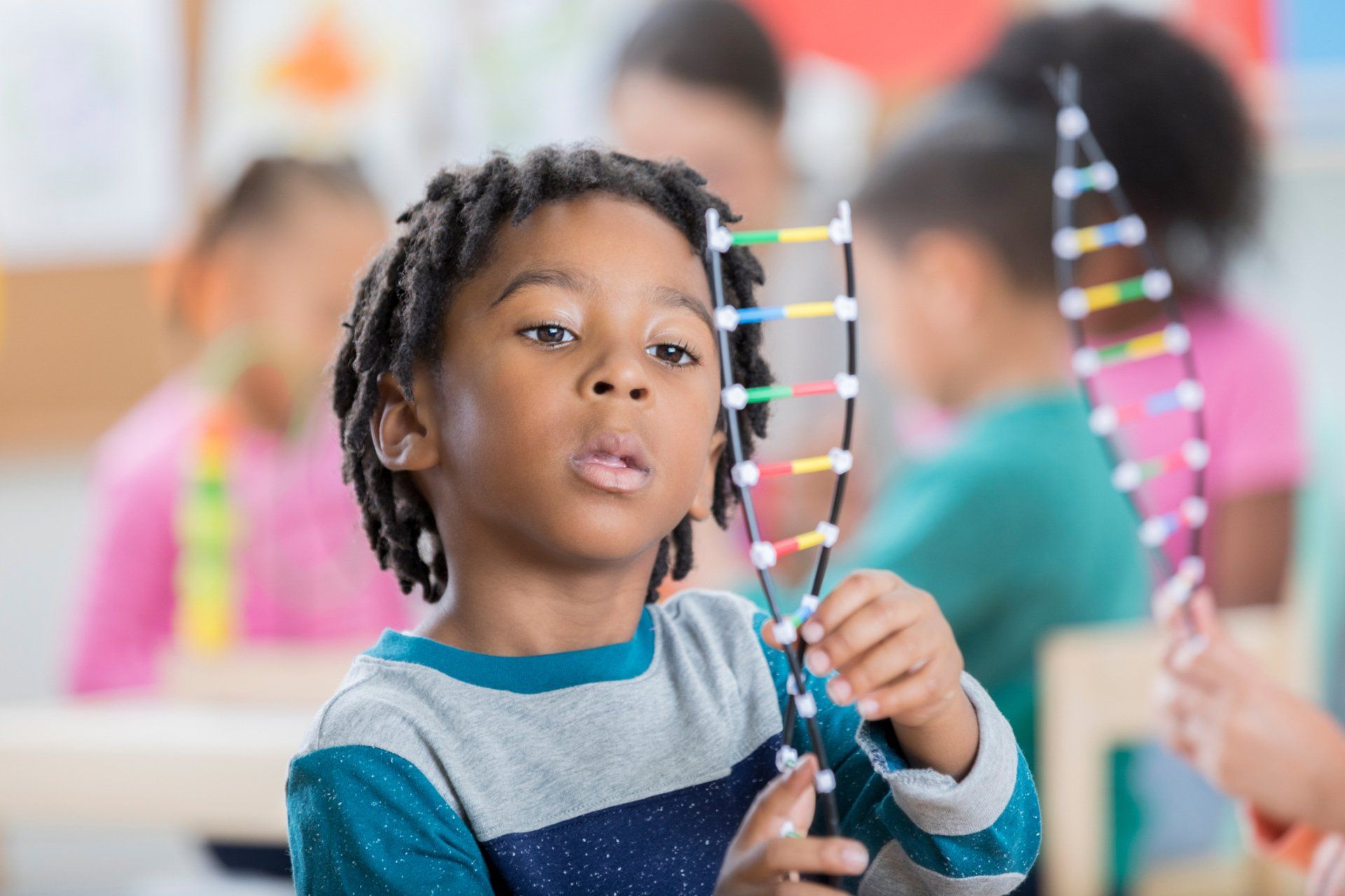 Little Boy Making DNA Toy — Tuscaloosa, AL — Tender Loving Care