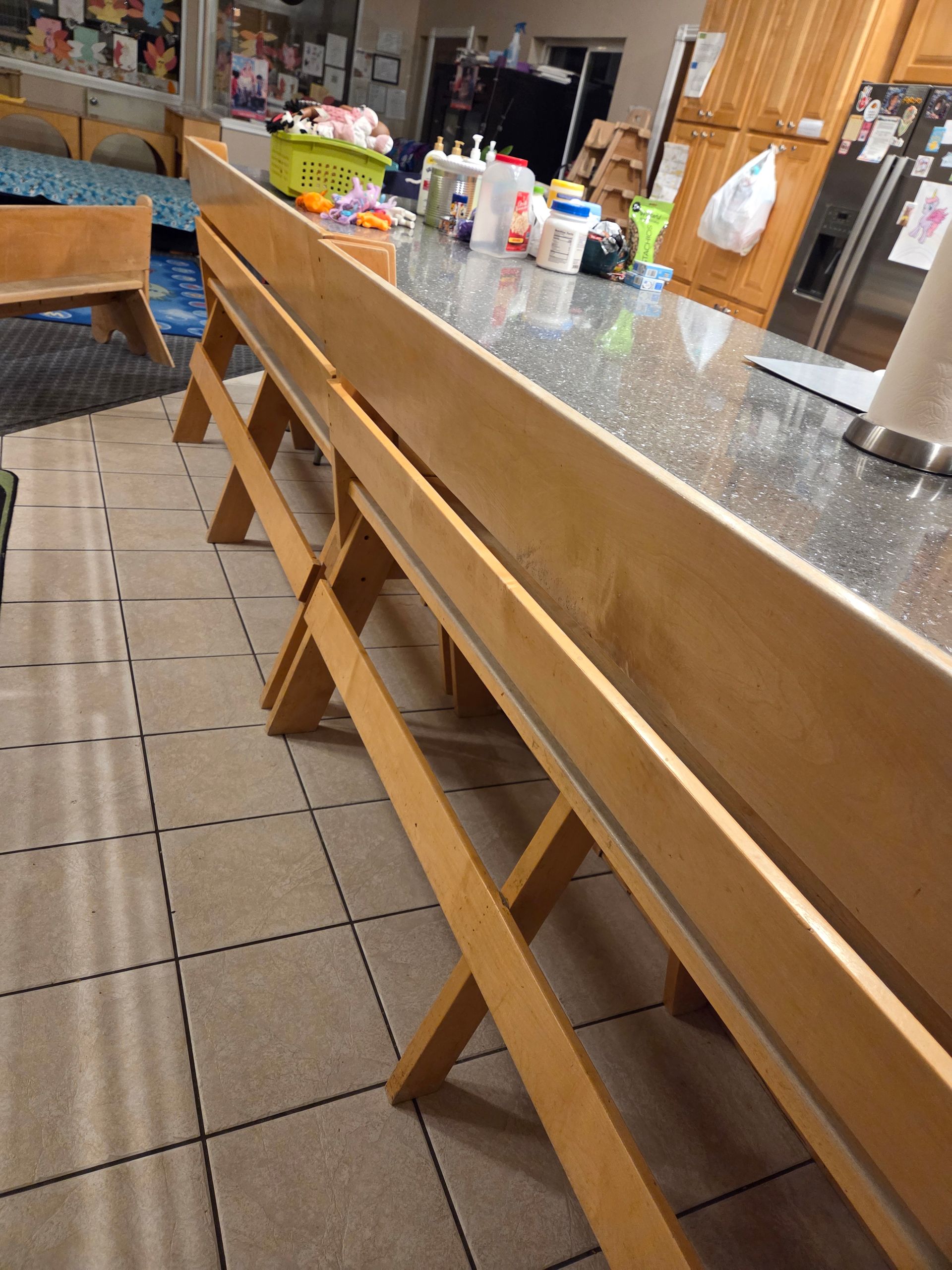 Empty diner counter with wooden stools and tiled floor in a casual restaurant