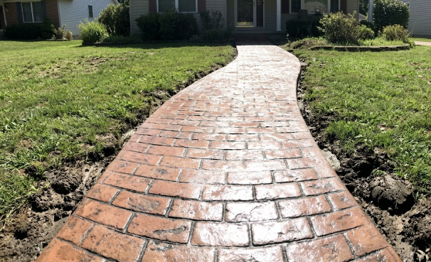 Beautiful stamped concrete patio in Walkersville MD featuring a natural stone pattern and outdoor furniture.