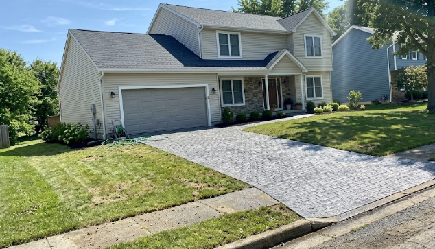A beautiful stamped concrete driveway in front of a suburban home in Ballenger Creek, MD.