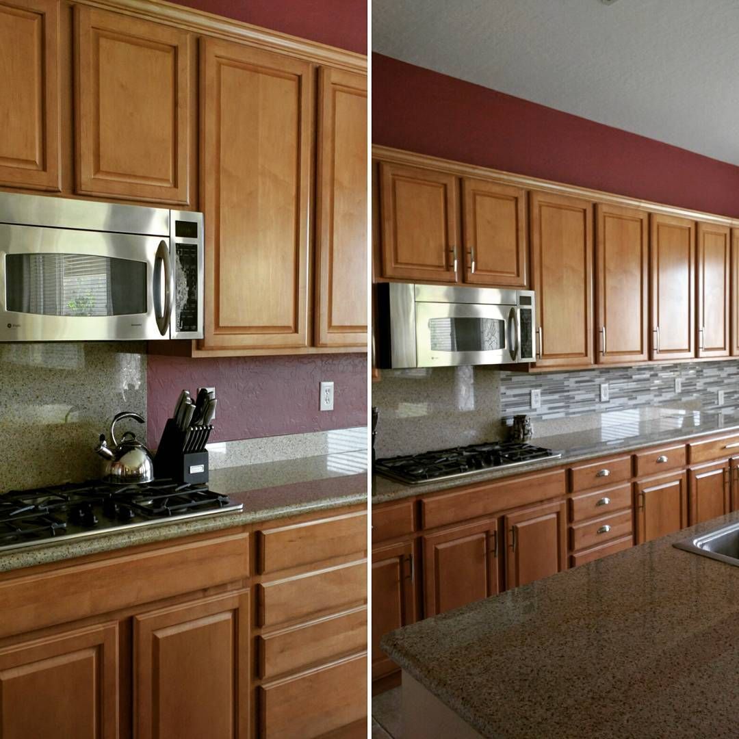 Kitchen with wooden cabinets, stainless-steel microwave, granite counters, and a tiled backsplash.