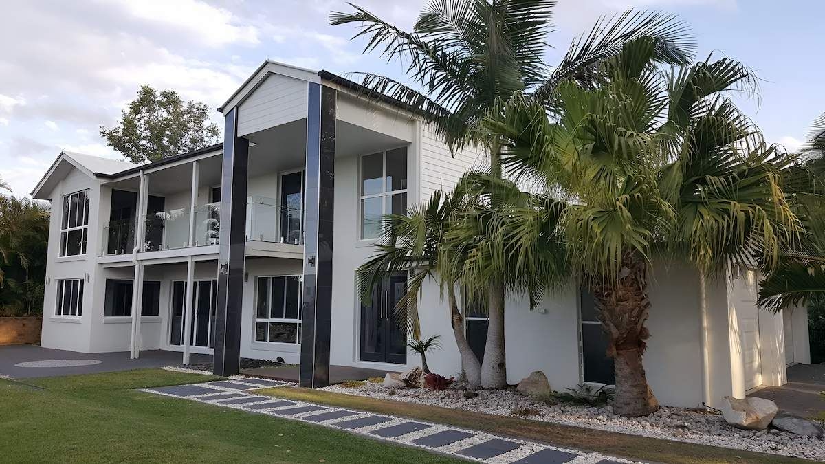A Large White House With Palm Trees in Front of It — MJ Render in Buderim, QLD