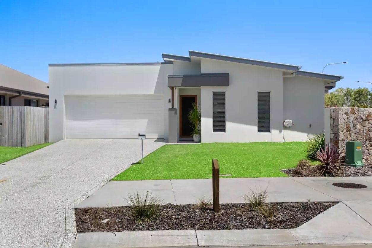A White House with A Driveway and Grass in Front of It — MJ Render in Buderim, QLD