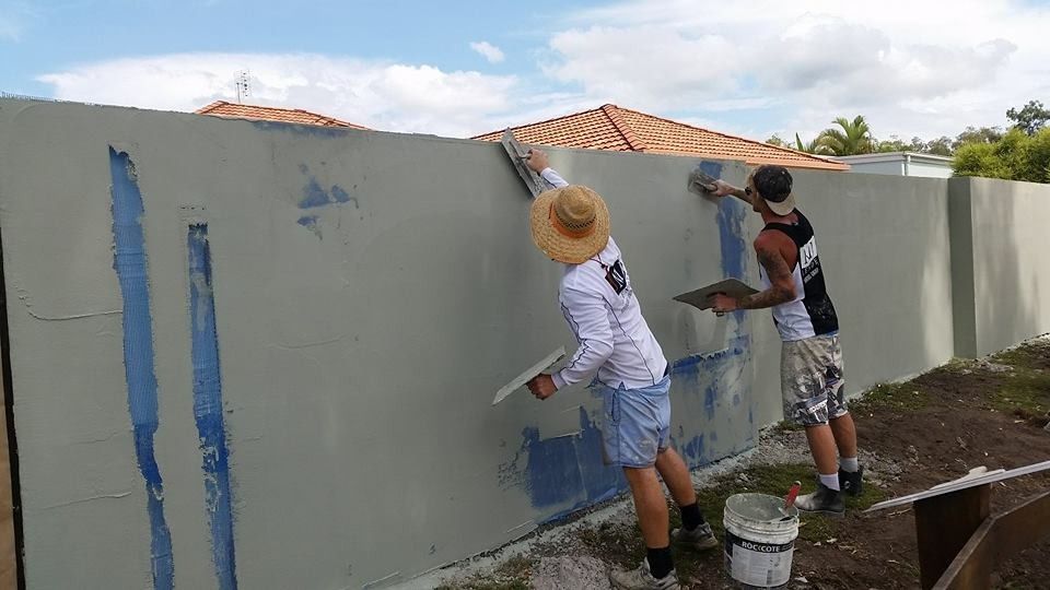 Two Men Are Painting a Fence with Blue Paint — MJ Render in Buderim, QLD