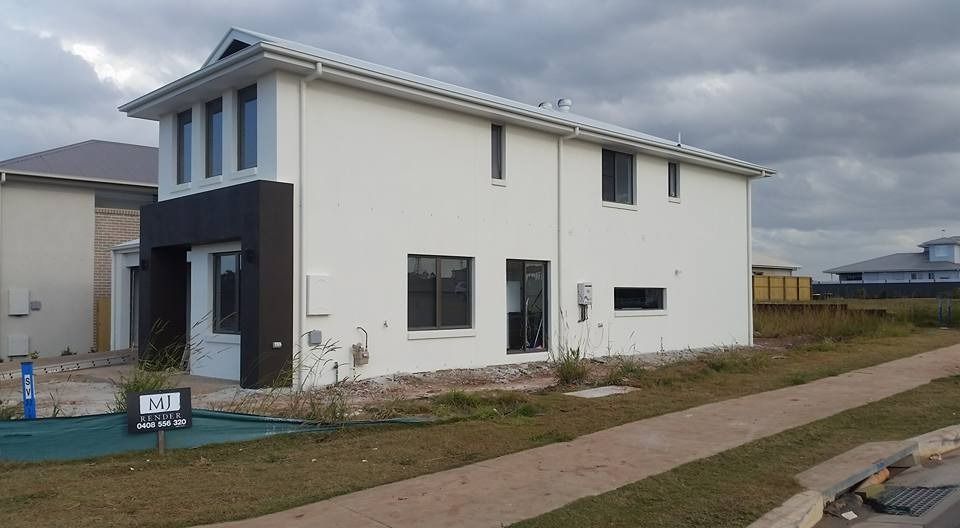 A White House with Black Trim Is Being Built in A Residential Area — MJ Render in Buderim, QLD
