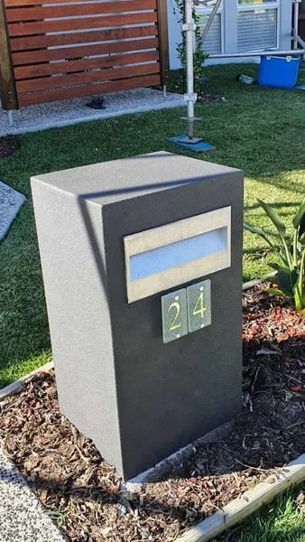A Mailbox Is Sitting in The Grass in Front of A House — MJ Render in Buderim, QLD
