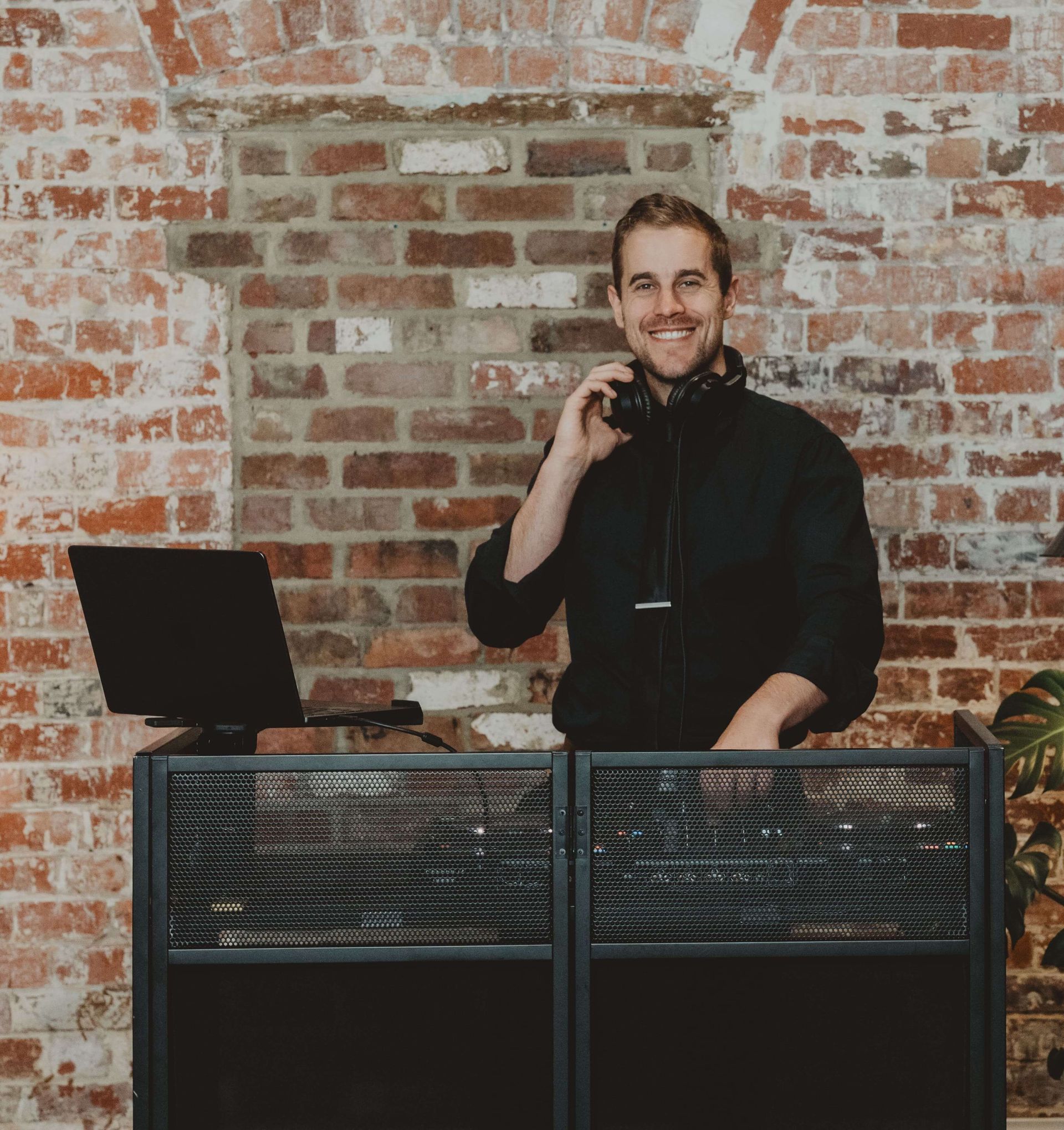 DJ mixing music at a corporate function in Melbourne
