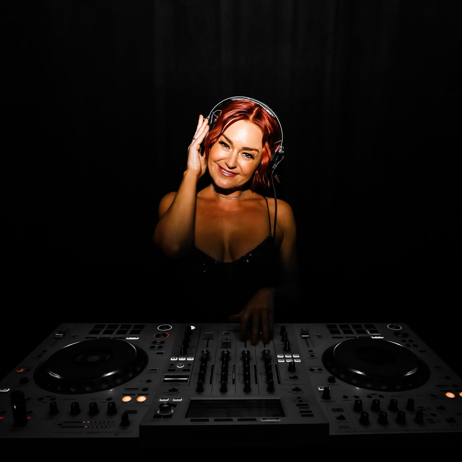 DJ performing at a Melbourne wedding reception with guests dancing