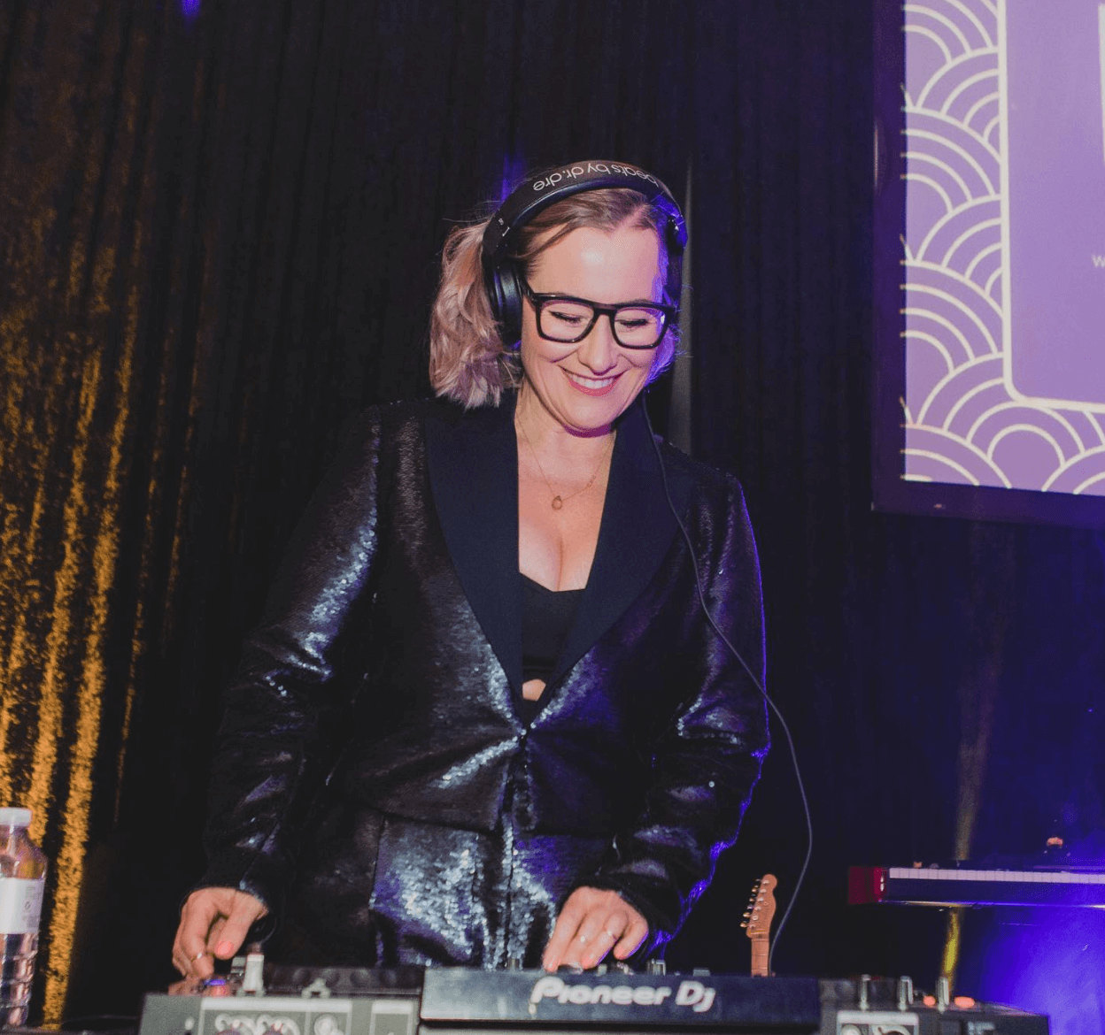 Experienced Perth wedding DJ mixing music for a high-energy dance floor