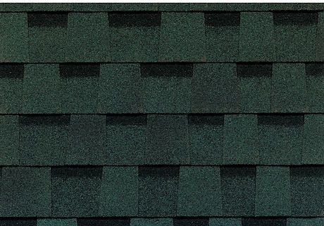 Dark green shingle roof with layered overlapping tiles and shadowed rows