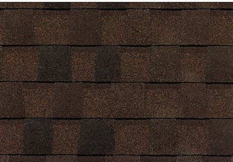 Brown shingle roof close-up with a square roof vent near the center