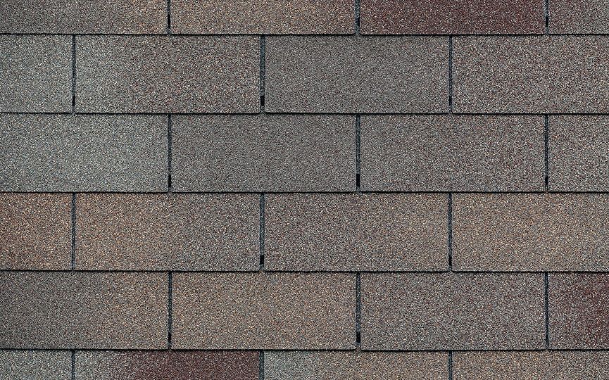 A close up of a row of shingles on a roof.