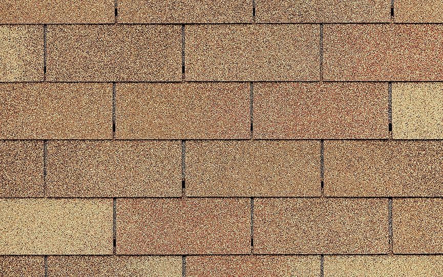 A close up of a row of brown bricks on a wall.