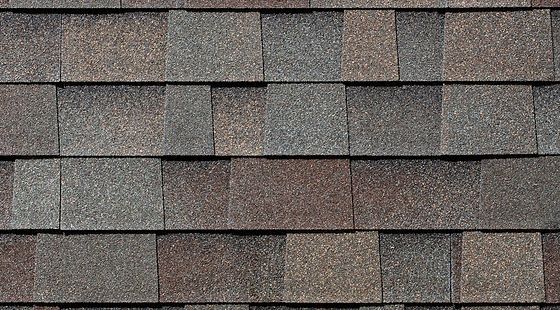 A close up of a roof with shingles on it.
