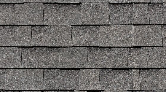 A close up of a gray shingle roof.