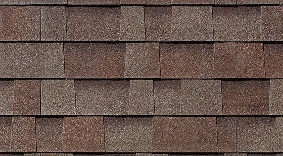 A close up of a roof with shingles on it.