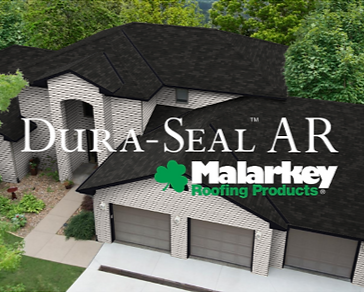 Dura-Seal AR Malarkey Roofing Products over a house with a dark shingle roof and garage
