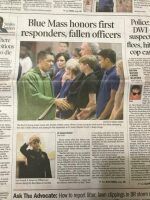 Newspaper front page with headline about a Blue Mass honoring first responders and fallen officers, with a group photo.