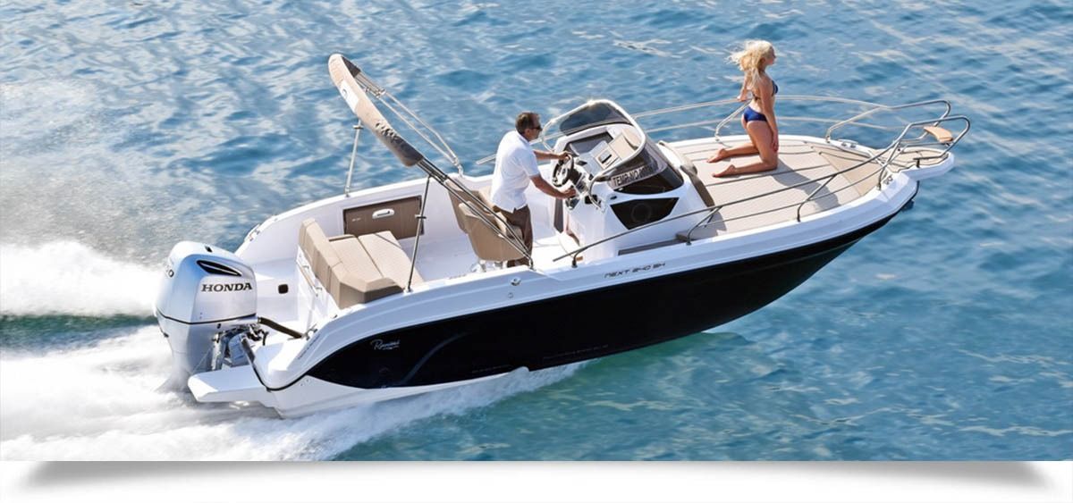 Small white motorboat speeding across blue water with two people aboard and a dog near the bow