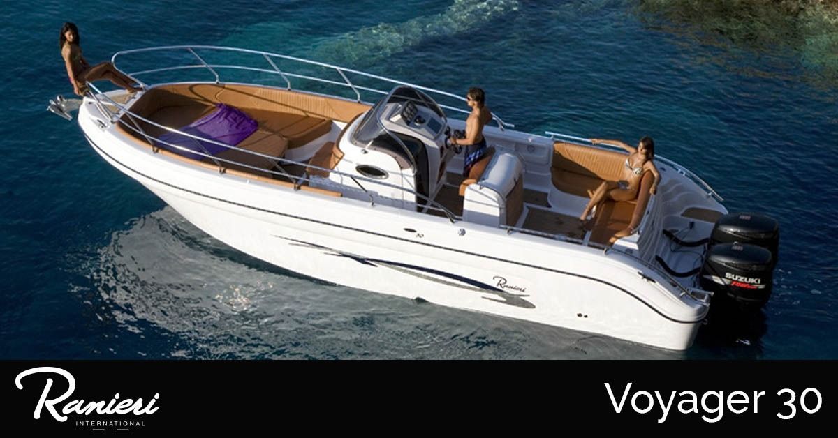 White luxury ranieri voyager 18 Sport boat cruising on blue water, with tan seating and Voyager 30 branding.