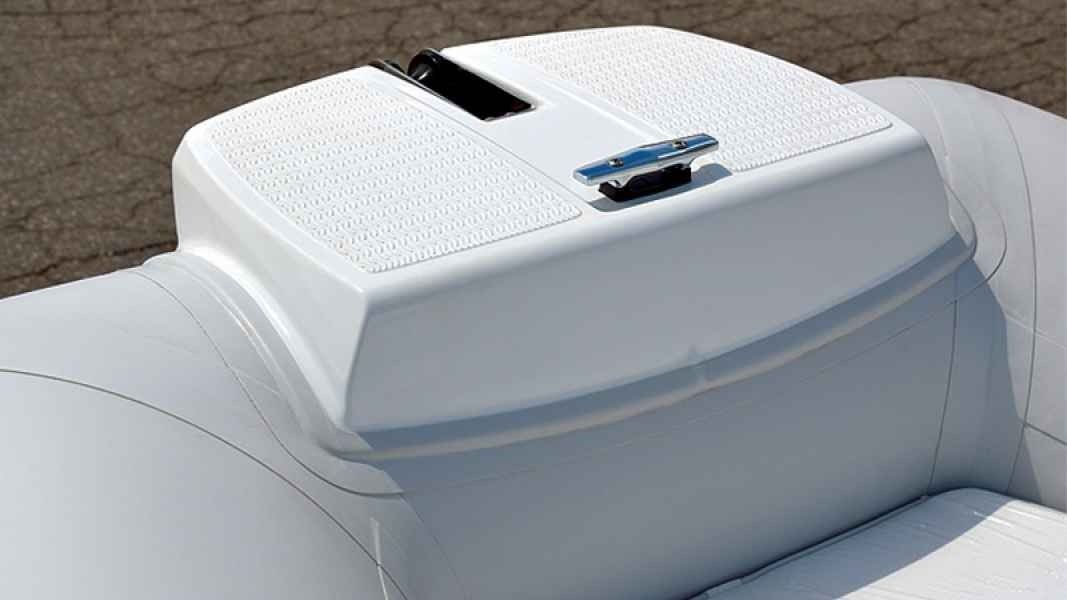 White leather car center console with a built-in touchscreen and cup holder in a luxury Grand Silver Line 470