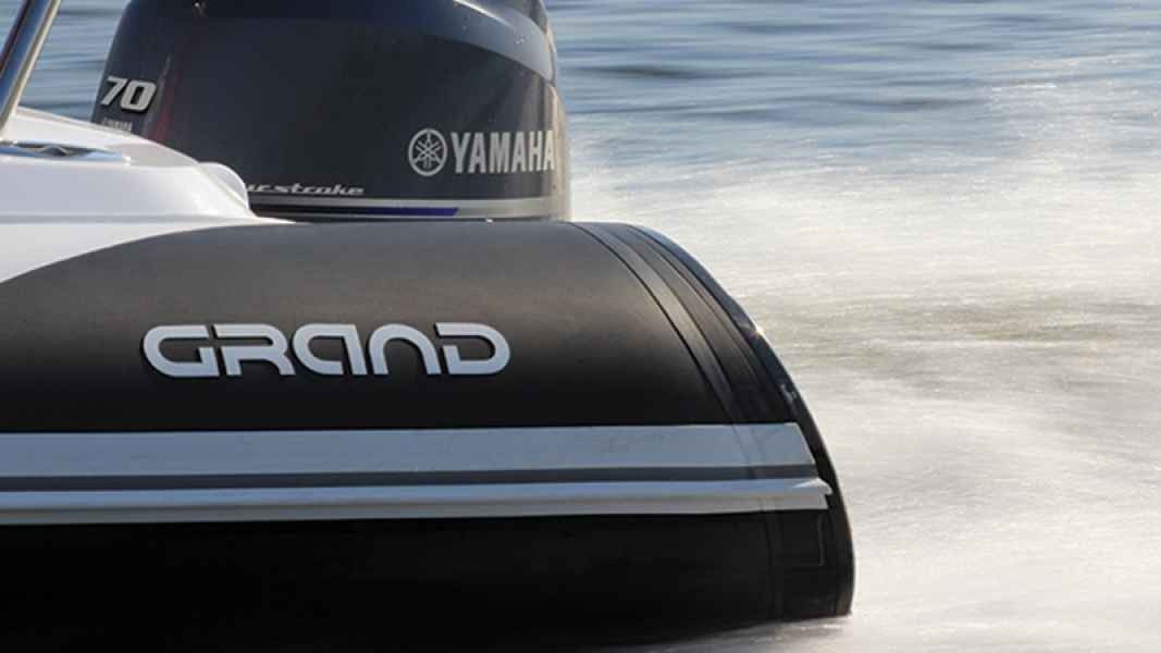 Close-up of a Yamaha engine on grand golden line 500 speedboat skimming across the water