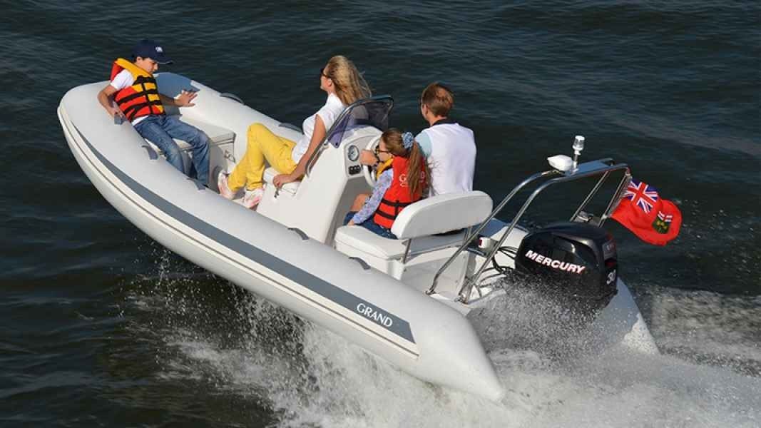 Passengers riding a white speedboat racing across choppy water, spraying wake behind it