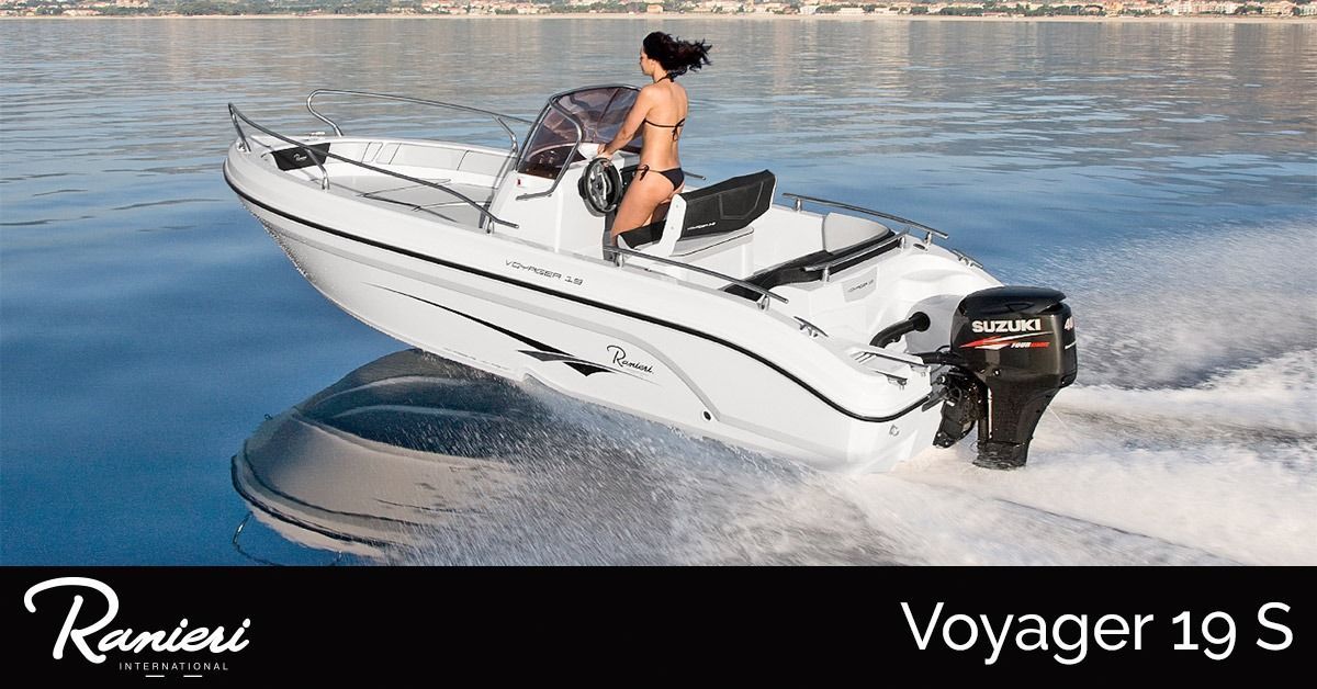 White ranieri voyager 19 speedboat on calm water with a person at the helm, creating a wake