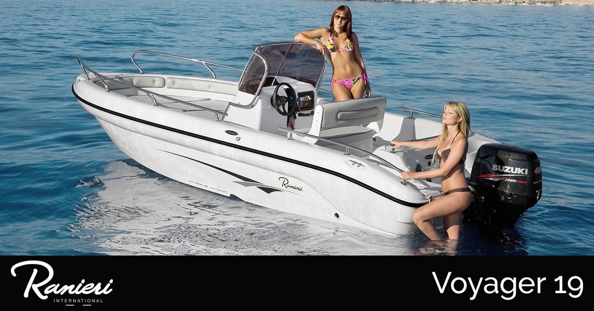 White ranieri voyager 19 speedboat on blue water with two women aboard and outboard motor at stern