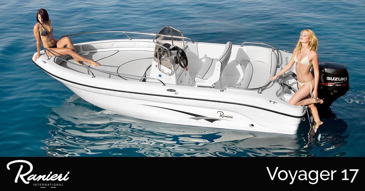 White ranieri Voyager 17 boat on blue water with two people seated at the bow and stern