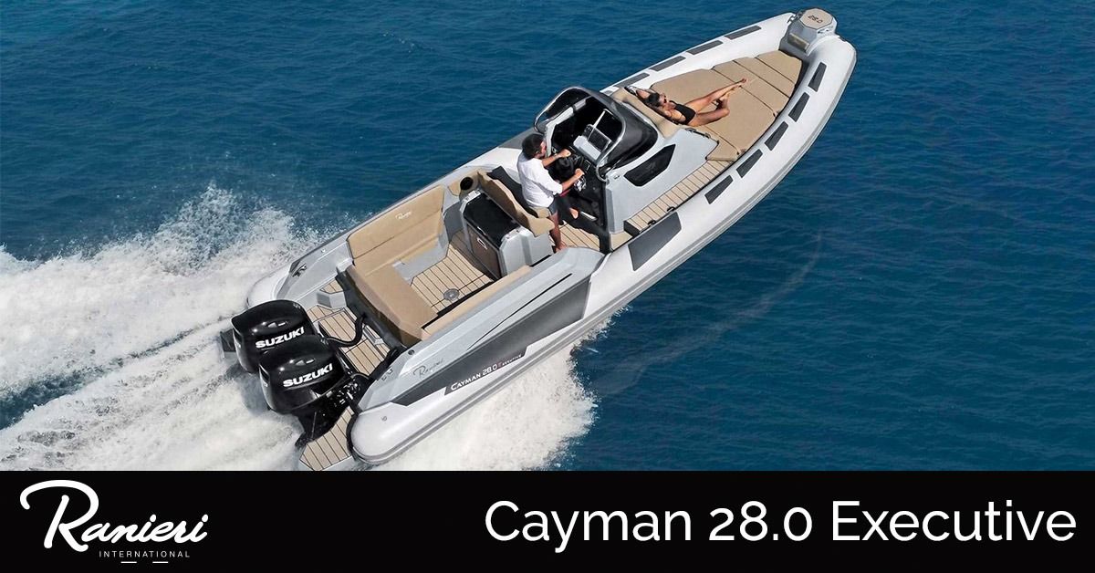 White powerboat speeding on blue water, labeled “Cayman 28.0 Executive”