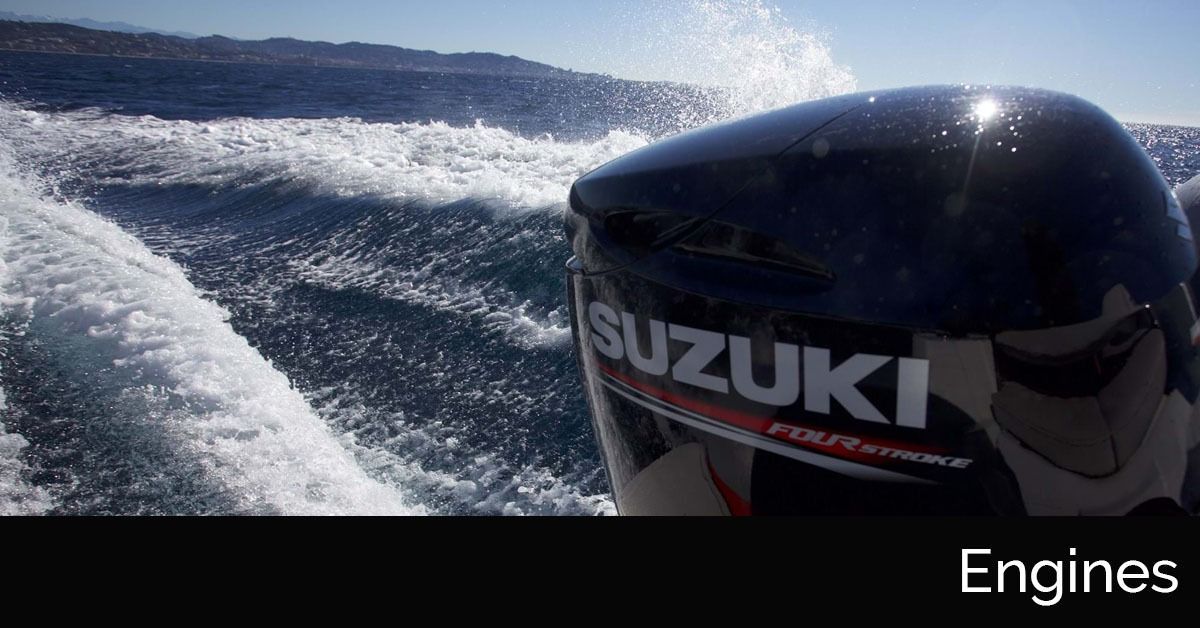 Suzuki outboard motor cutting through choppy blue water with white wake behind it