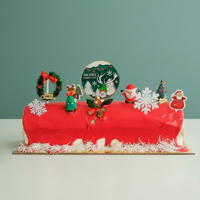 Red Christmas log ice cream cake with decorations