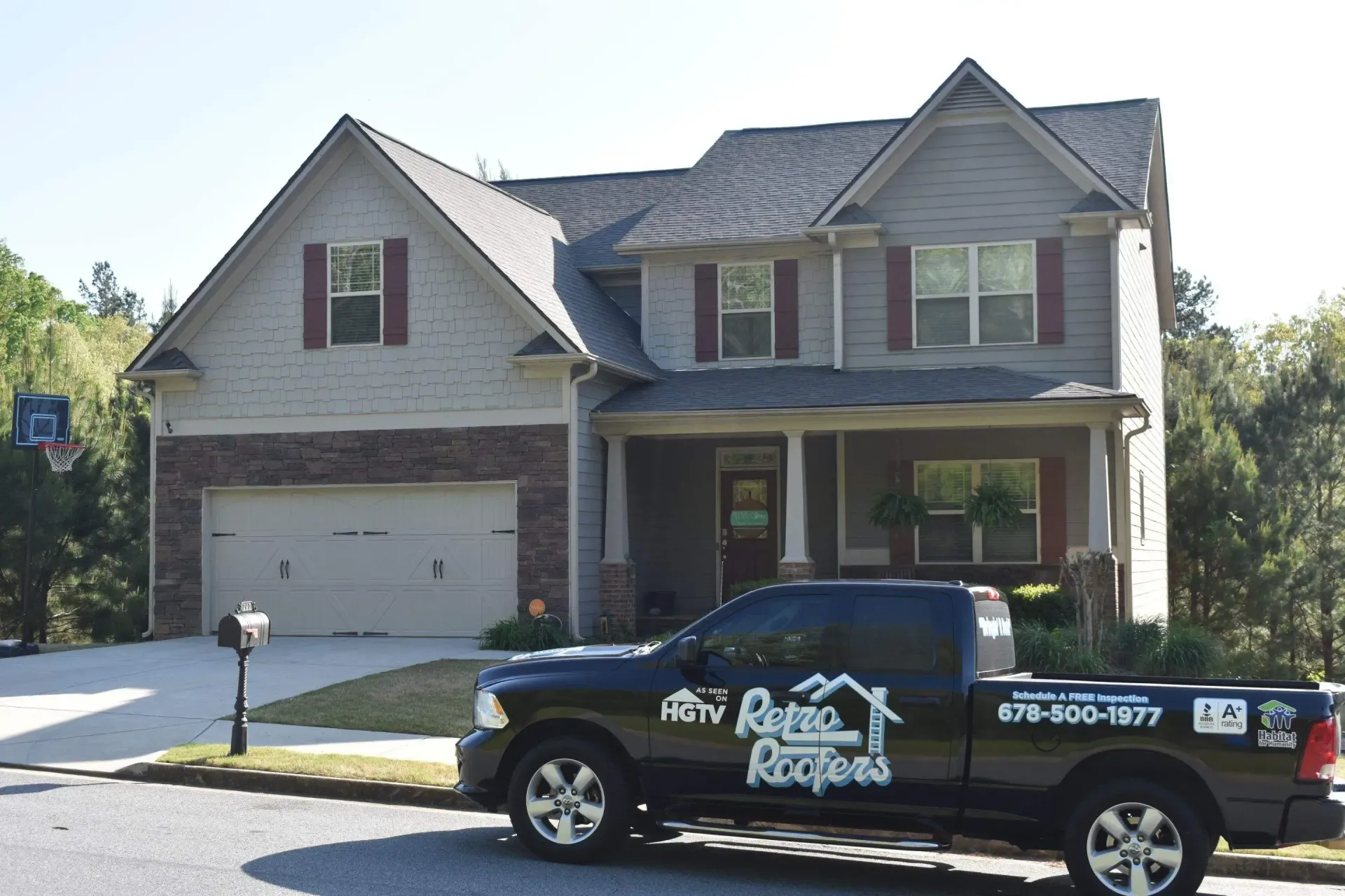 Black truck in front of a house, with 