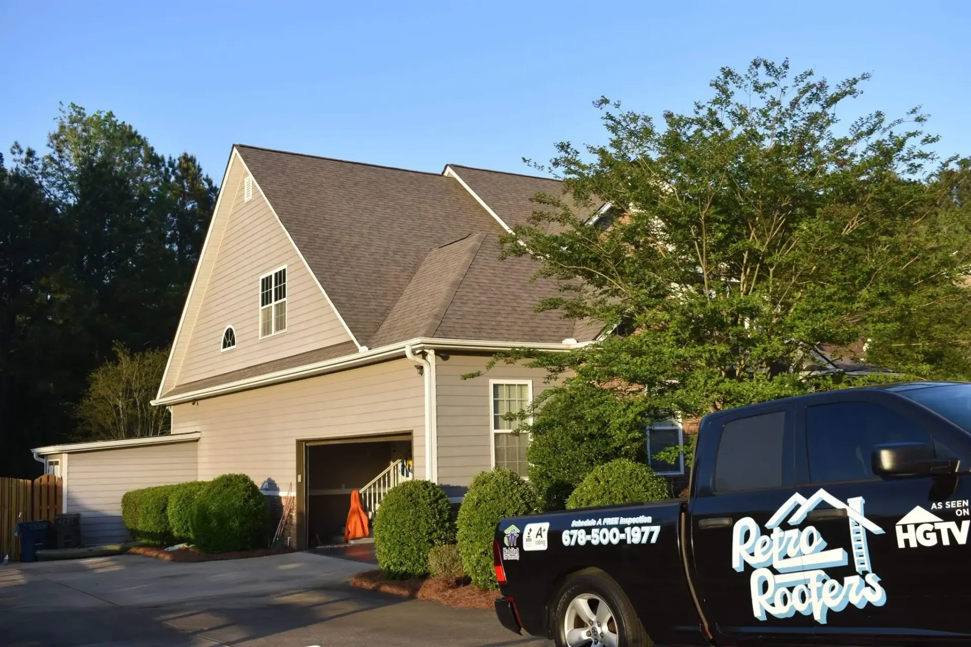 House with new roof; truck with