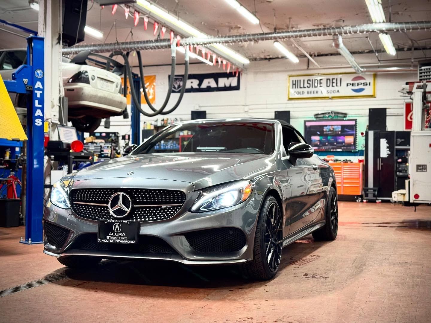 A Mercedes Benz is Parked in a Garage on a Lift | Motorwerks Inc